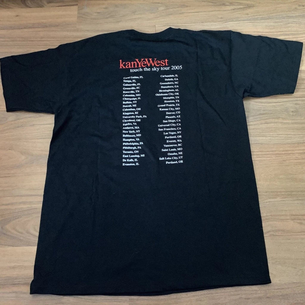 Black 'Touch the Sky Tour 2005' T-shirt with Kanye West tour dates printed on the back for hip-hop memorabilia.