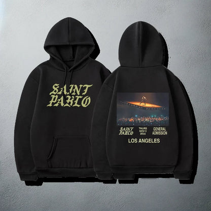 Black 'Saint Pablo' tour hoodie with event details and concert image on the back, and bold yellow text on the front, for Kanye merchandise