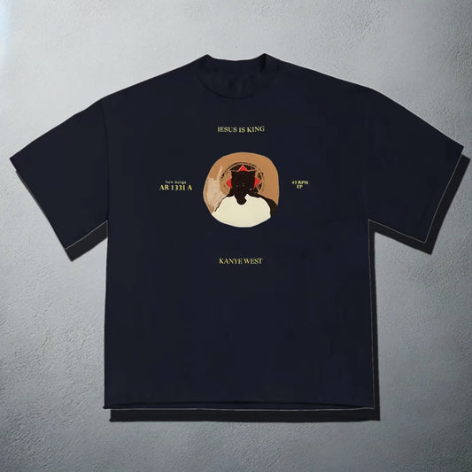 Navy blue t-shirt featuring the 'Jesus is King' album art with vinyl record design, showcasing Kanye West's iconic bear mascot in a crown, emphasizing the album's gospel influence.