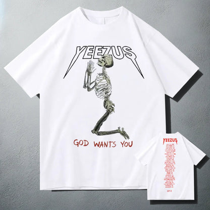 White 'Yeezus' T-shirt with a white praying skeleton graphic and 'God Wants You' text, showcasing a bold design inspired by Kanye West's album