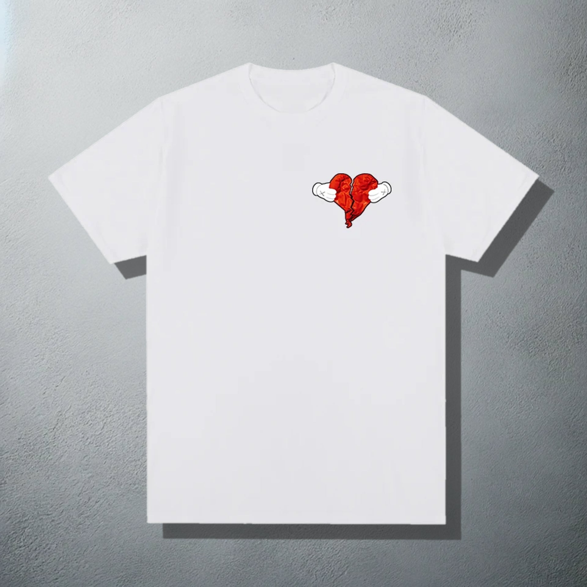 White T-shirt featuring a 'Heartless' inspired red heart with wings graphic, referencing Kanye's '808s & Heartbreak' album